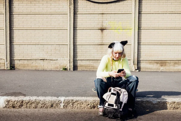 Young Diverse Nonconformist Woman Sitting Outdoors Using Smartphone Connected Technology — Stock Photo, Image