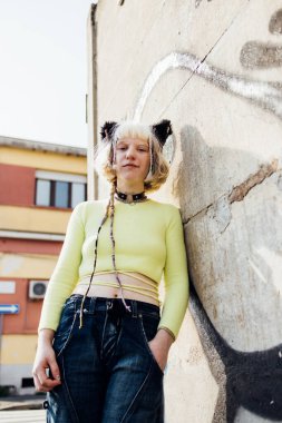 Smiling non binary gender fluid woman posing outdoor looking camera diversity pride