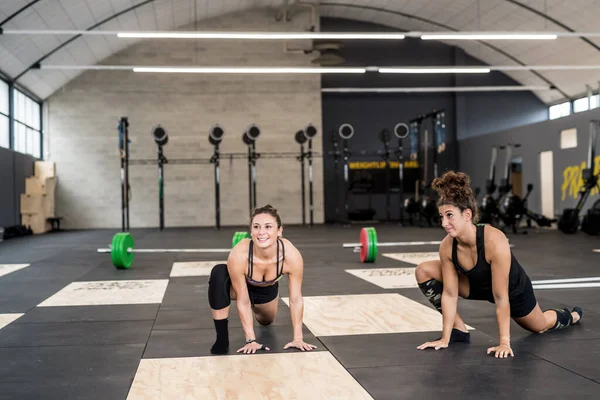 Two Sportive Fit Women Wearing Sportswear Training Together Indoors Gym — Fotografia de Stock