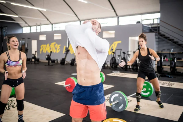 Athletic Young Muscular Man Indoors Gym Putting Shirt — Fotografia de Stock