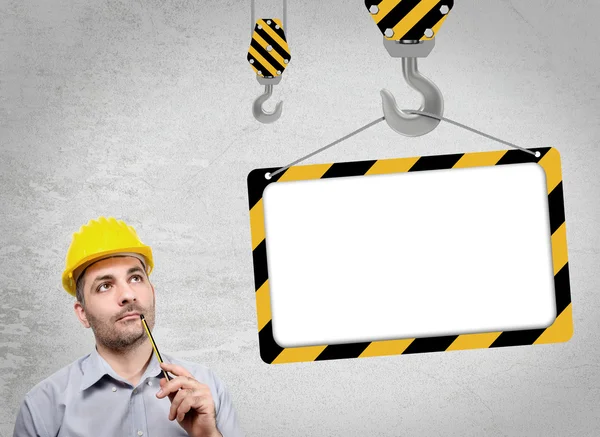 Engineer with a helmet on his head — Stock Photo, Image