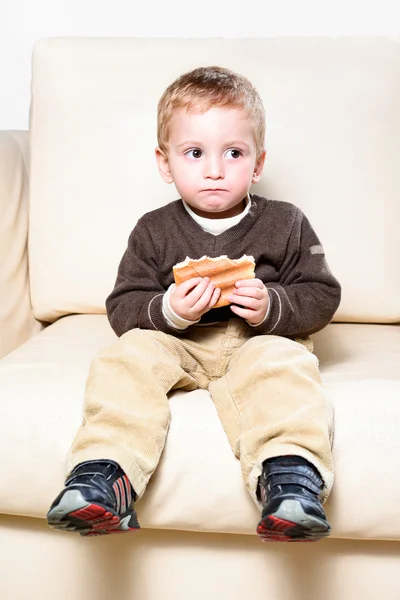 Child eating a toast — Stock Photo, Image