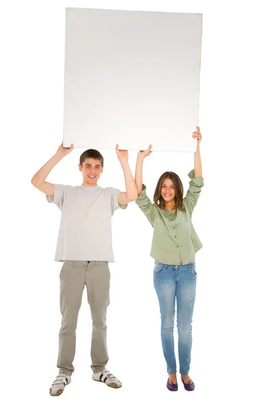 Couple of teenagers with white panel — Stock Photo, Image