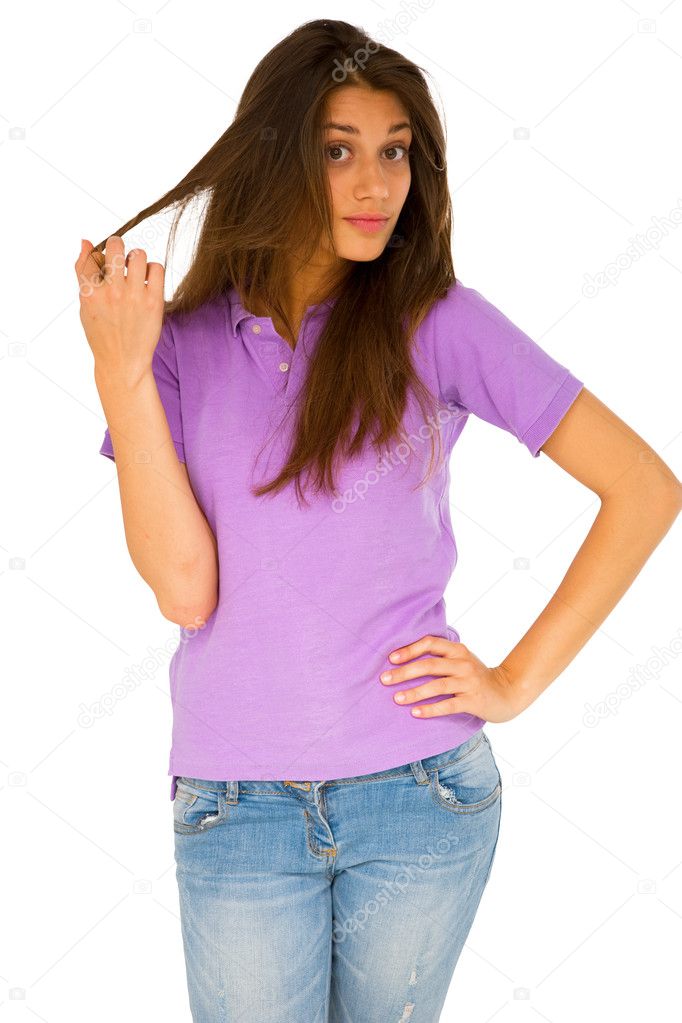 Teenage girl running fingers through hair