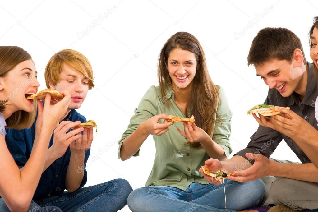 Teenagers eating pizza