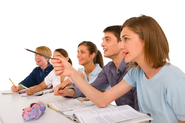 Teenagers in classroom — Stock Photo, Image