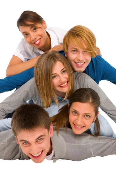 Teenagers laying in pile — Stock Photo, Image