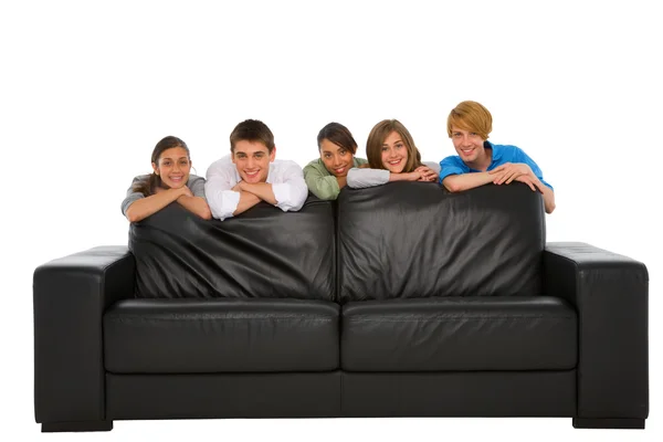 Teenagers behind sofa — Stok fotoğraf