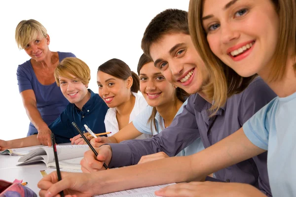 Teenagers in classroom — Stock Photo, Image