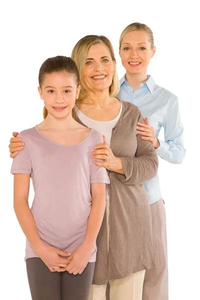 Granddaughter grandmother young mother standing on white backgro — Stock Photo, Image