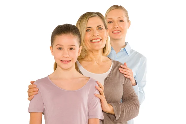 Granddaughter grandmother young mother standing on white backgro — Stock Photo, Image