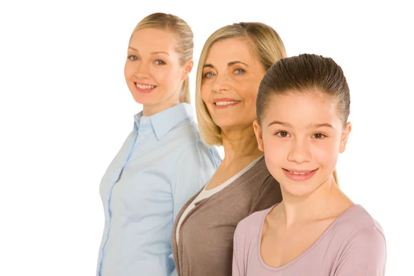 Granddaughter grandmother young mother standing on white backgro — Stock Photo, Image