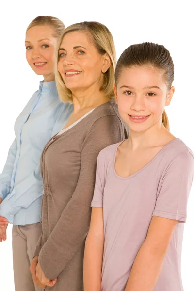 Granddaughter grandmother young mother standing on white backgro — Stock Photo, Image