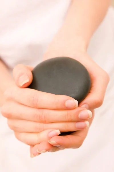Close-up of a woman holding stones — Stock Photo, Image