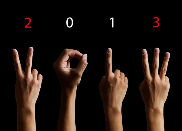 The number 2013 shown by fingers in creative New Year greeting c — Stock Photo, Image