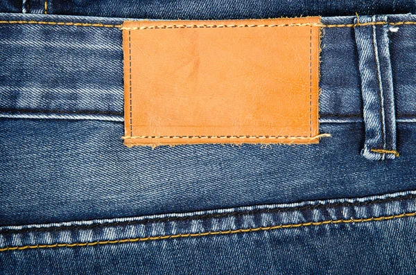 Leather jeans label sewed on jeans