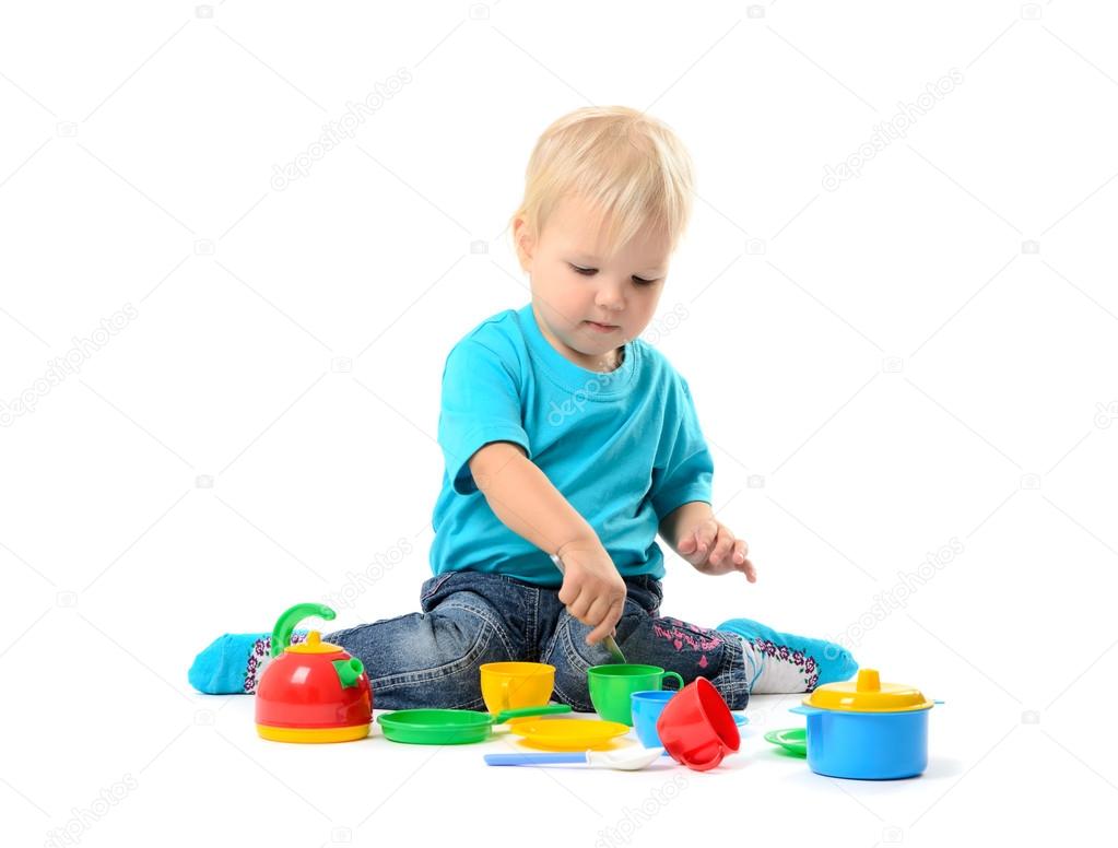 Cute kid girl playing with toy