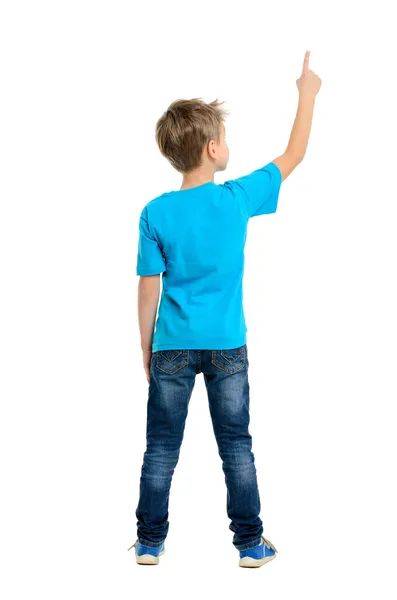 Rear view of a school boy over white background pointing upwards — Stock Photo, Image