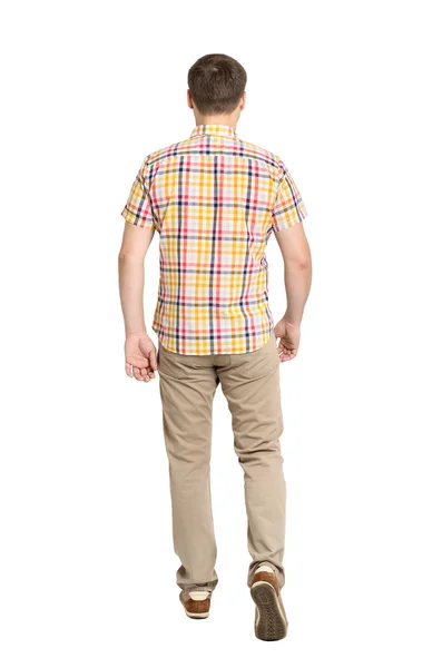 Back view of going handsome man in jeans and a shirt — Stock Photo, Image