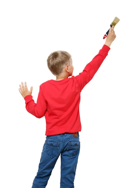 Niño pequeño con pincel en la pared, vista trasera — Foto de Stock