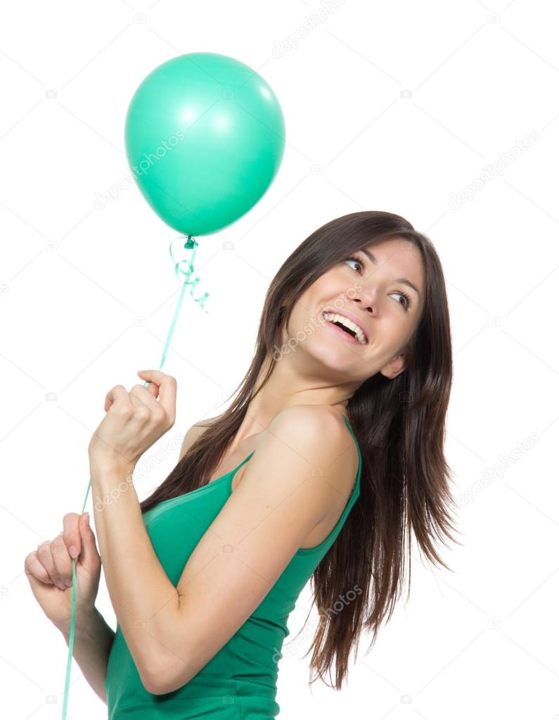 Young happy girl with green balloon
