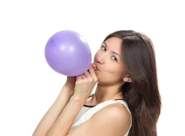 Joven chica feliz soplando globos para fiesta de cumpleaños —  Fotos de Stock