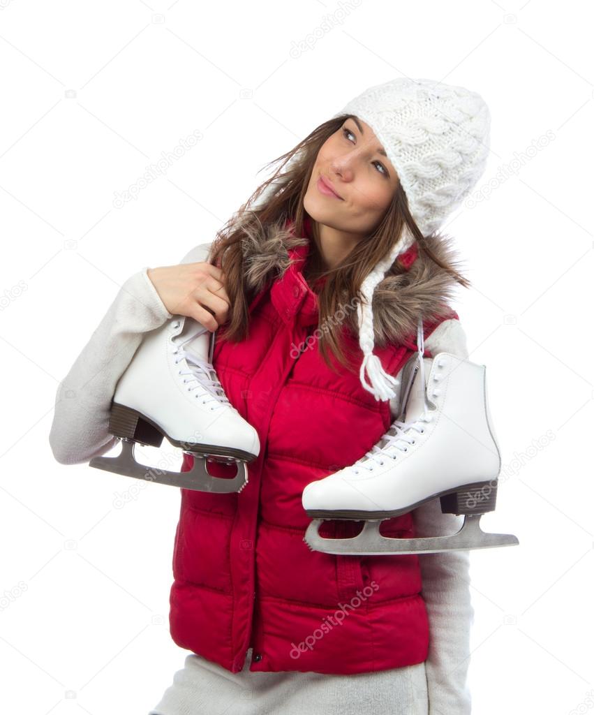 Young woman holding ice skates for winter ice skating