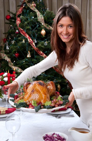 Woman holding Roasted christmas turkey — Stock Photo, Image