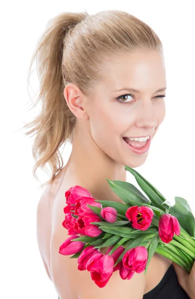 Beautiful woman with bouquet of red tulips flowers — Stock Photo, Image