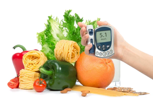 Diabetes concept glucose meter in hand fruits, vegetables — Stock Photo, Image