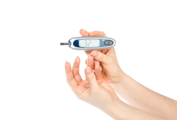Glucometer in hand for measuring glucose level blood test — Stock Photo, Image