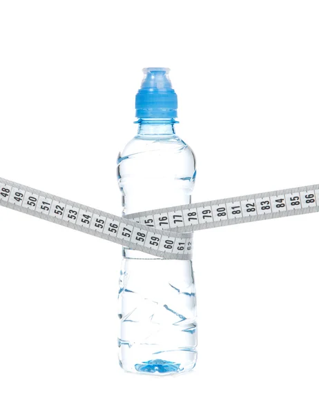 Diet bottle of drinking water and tape measure — Stock Photo, Image