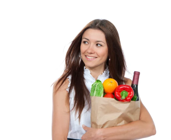 Mujer sosteniendo una bolsa de papel llena de comestibles —  Fotos de Stock