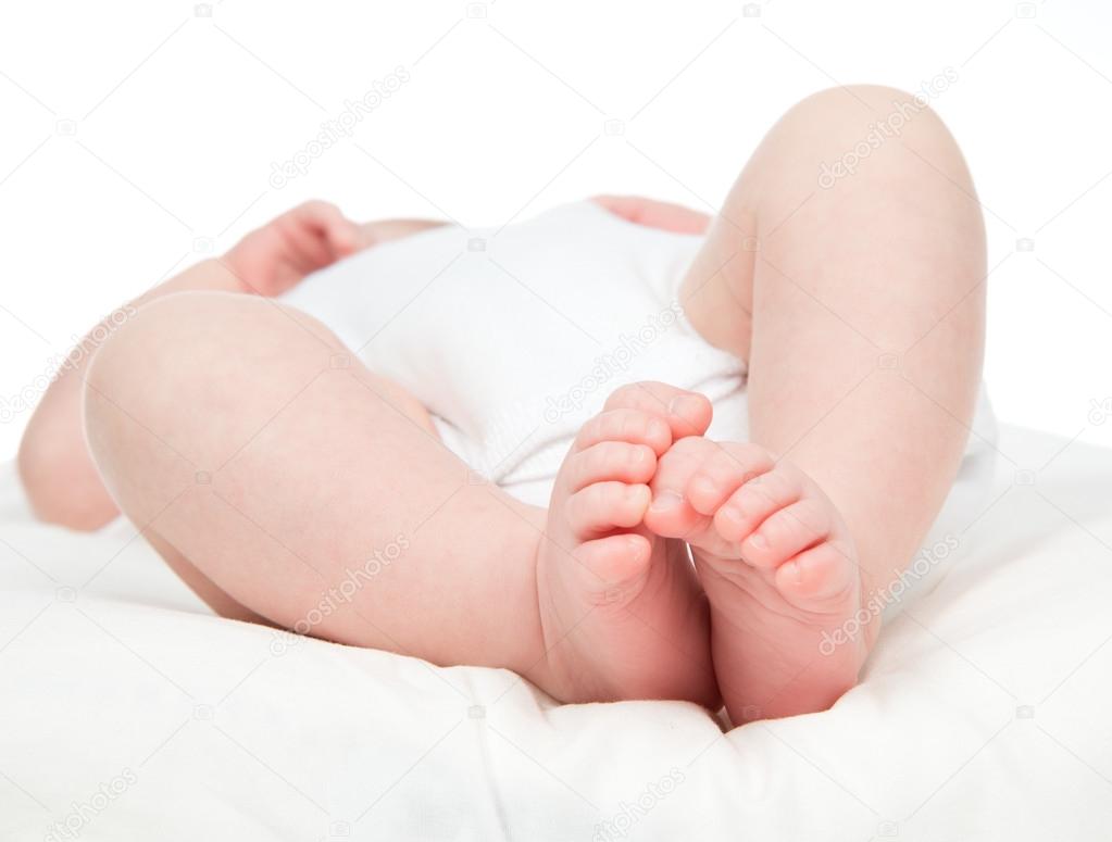 One month new born child baby foot legs o