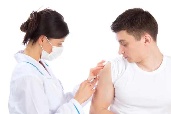 Doctor give flu vaccination or insulin injection Stock Image