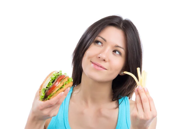 Woman with tasty fast food unhealthy burger Royalty Free Stock Images