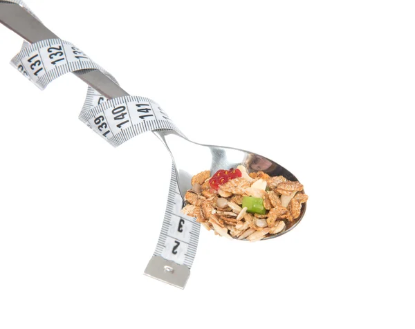 Muesli cereals spoon with tape measure centimetr — Stock Photo, Image
