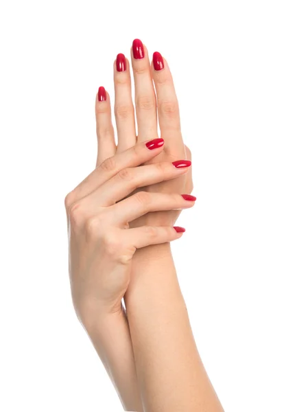 Manos de mujer con uñas de manicura rojas — Foto de Stock