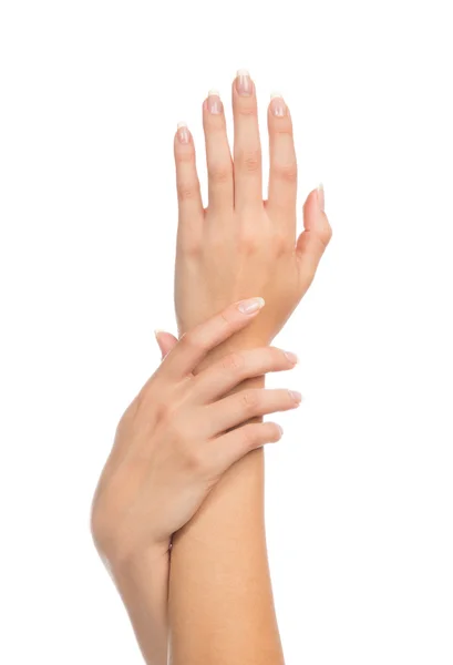 Gezonde jonge vrouwelijke ands met Franse manicure nagels — Stockfoto