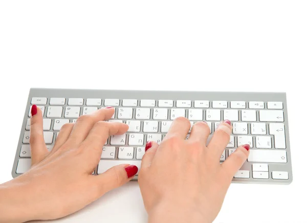 Hands typing on the remote wireless computer keyboard — Stock Photo, Image