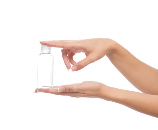 Mão segurar vidro vazio ou frasco de creme de gel de chuveiro de plástico conter — Fotografia de Stock