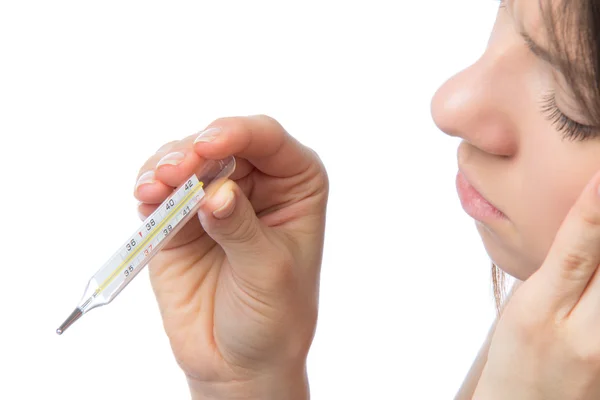 Woman with thermometer checking her body temperature — Stock Photo, Image