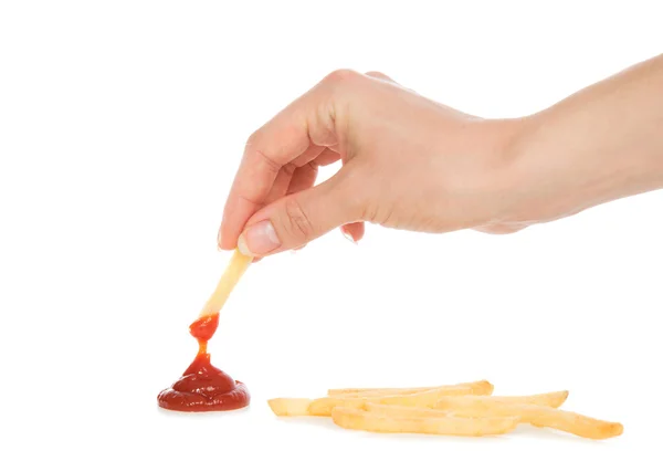 Hand dip french fries chips into ketchup — Stock Photo, Image