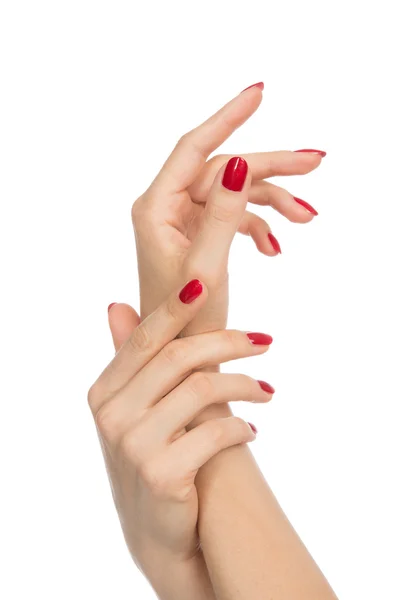 Mani donna con unghie rosse curate — Foto Stock