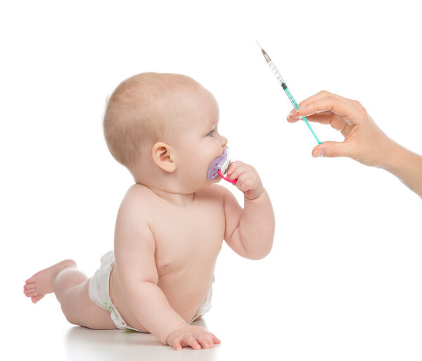 Infant child baby kid hand with medical insulin syringe