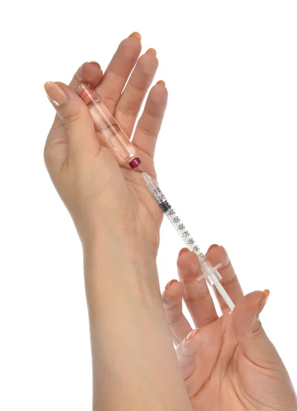 Médecin avec seringue médicale avec aiguille en ampoule — Photo