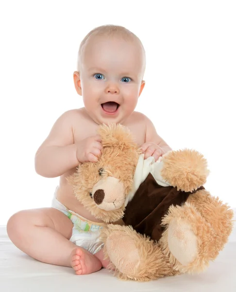 Niño bebé niña gritando en pañal con oso de peluche — Foto de Stock