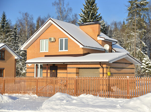 Brick cottage house in winter t