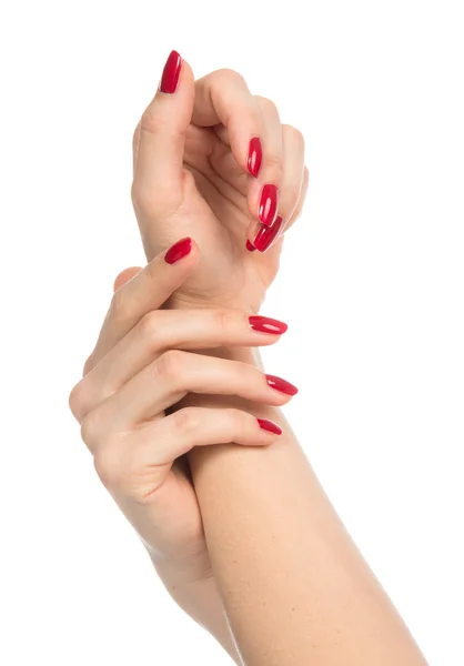 Mãos de mulher com unhas vermelhas manicured — Fotografia de Stock
