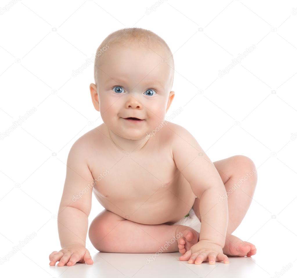 Infant child baby girl blue eyes in diaper sitting happy smiling